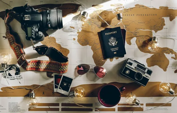 US passport on a world map. The fee to renounce US citizenship just dropped from $2,350 to $450